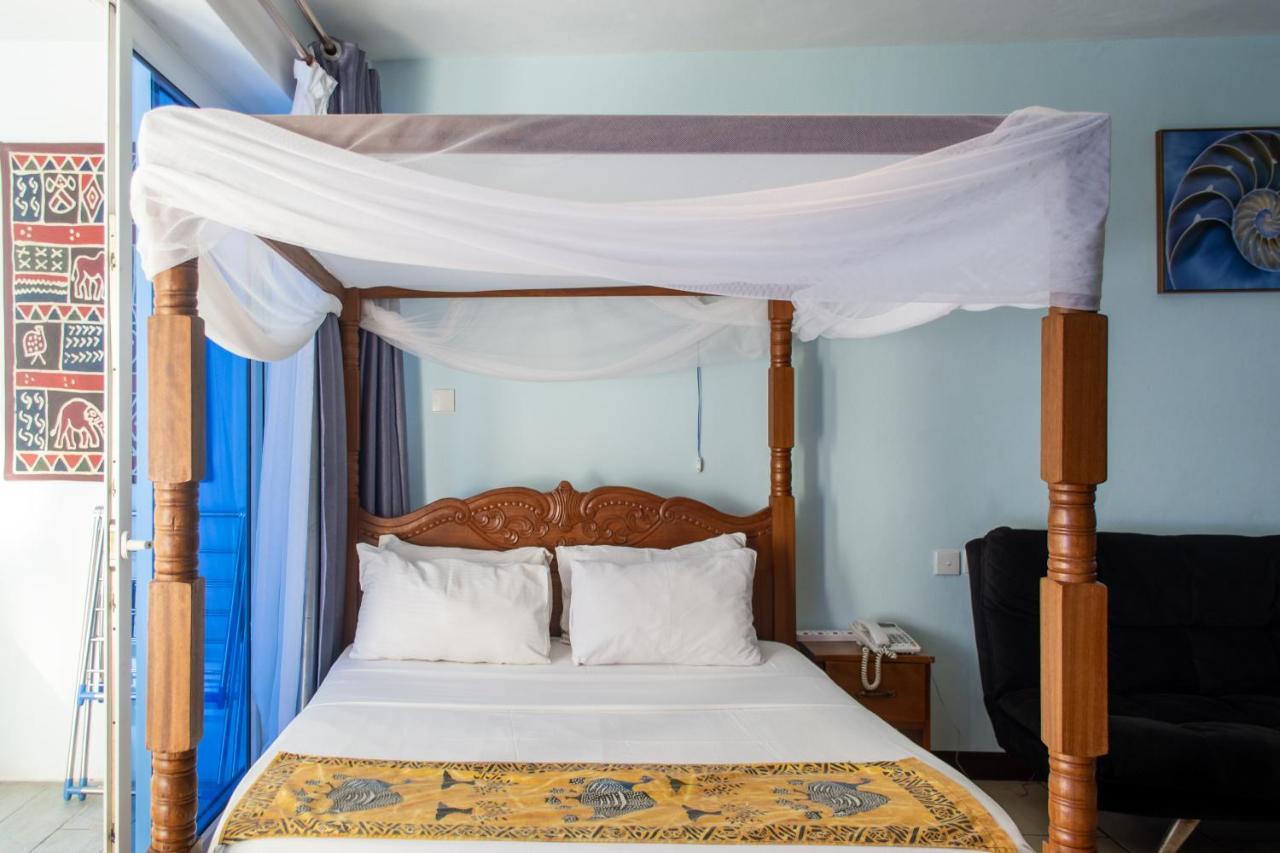 Cowrie Beach Haven Studio Apartment Mombasa Bagian luar foto
